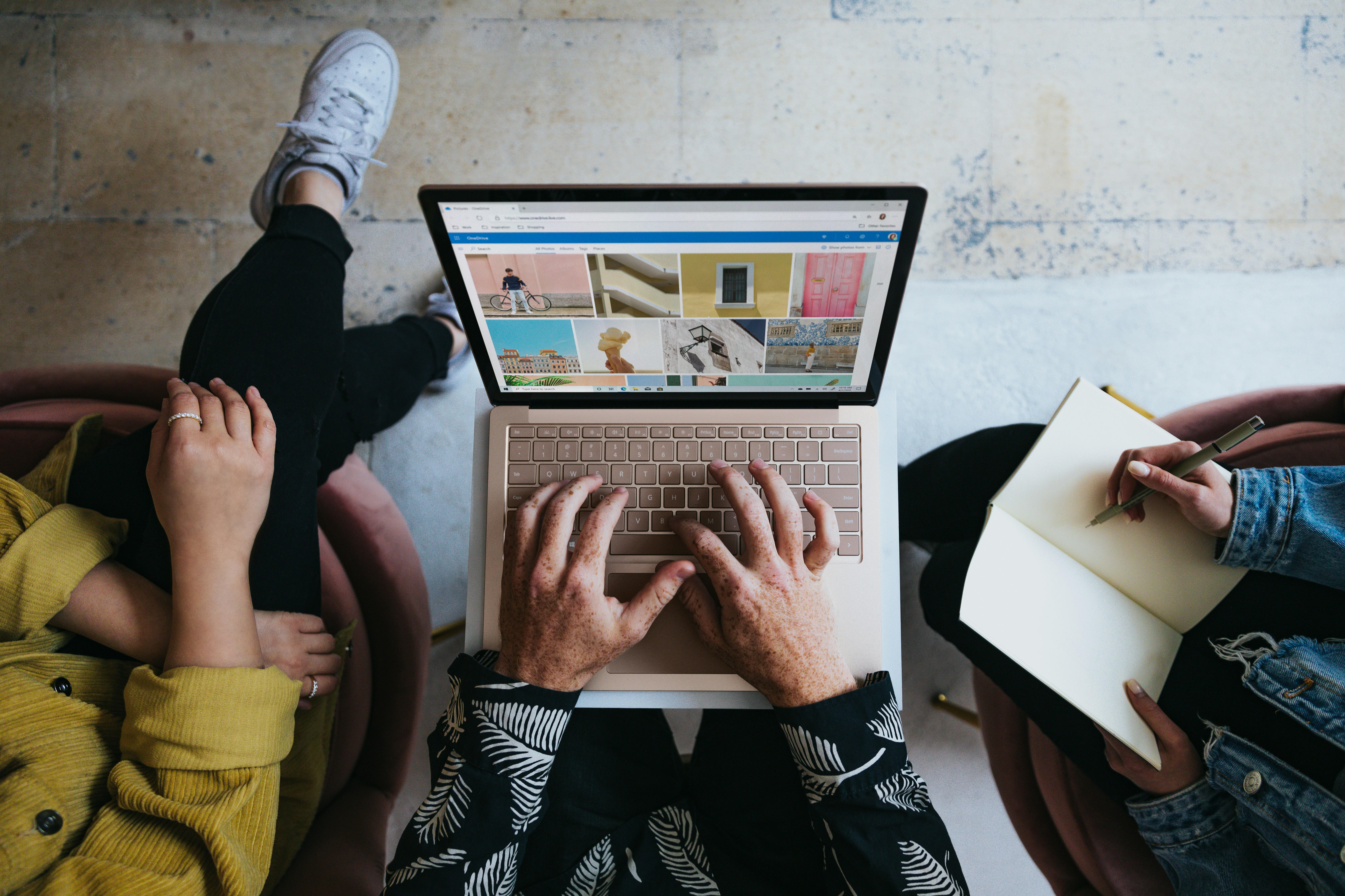 Creators collaborating on a laptop